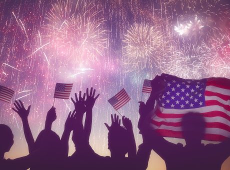 Patriotic,Holiday.,Silhouettes,Of,People,Holding,The,Flag,Of,Usa.